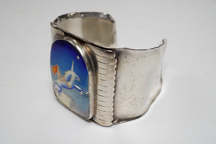 A modern Macy's of New York sterling and polychrome enamel 'Grain of Sand' bangle, gross 83 grams. Condition - poor to fair